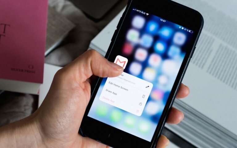 Brevo vs ConvertKit 2026 comparison — smartphone with email app, email marketing tools for creators